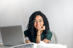 Freelance writer creating educational materials for edtech using a laptop at home