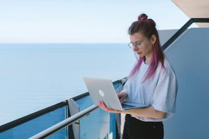 Young woman writing compelling travel narratives