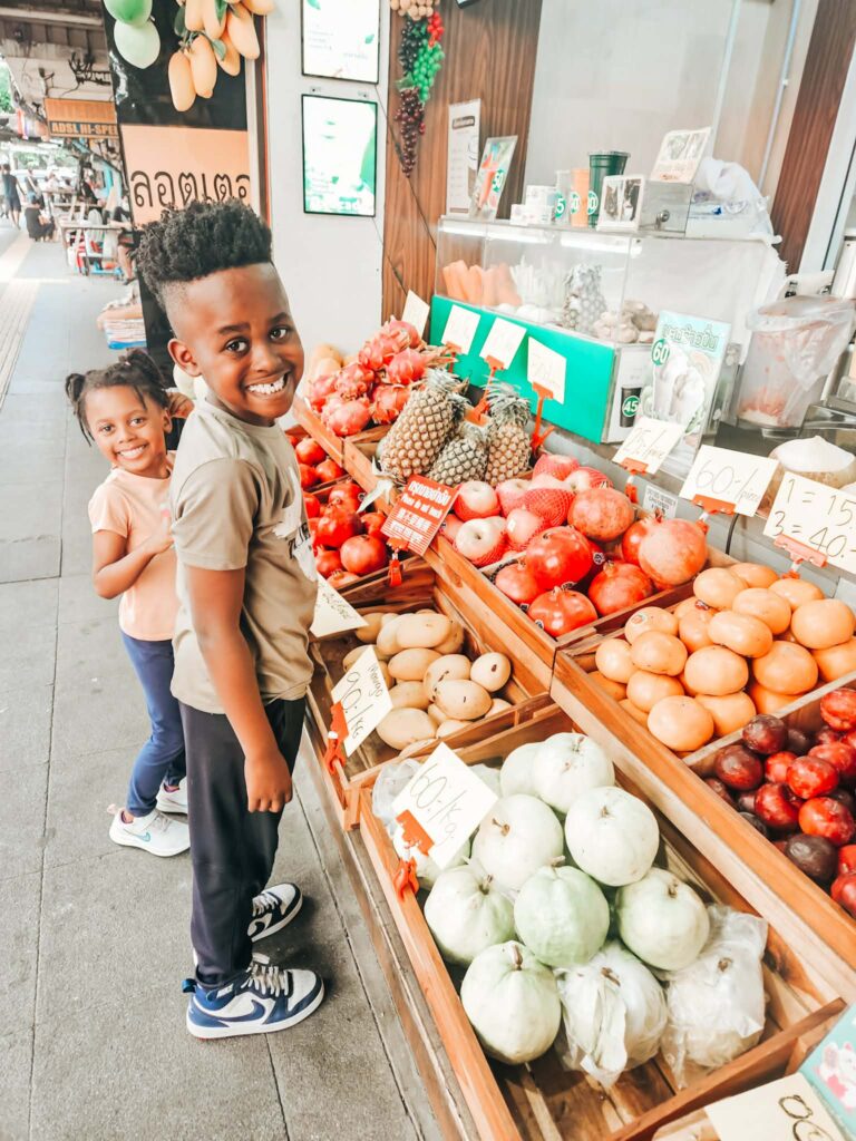 Worldschooling in Bangkok with kids exploring local markets