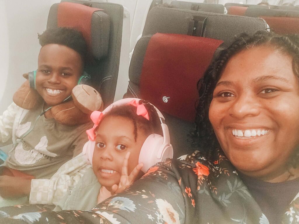 Family on plane leaving America to start worldschooling in Bangkok